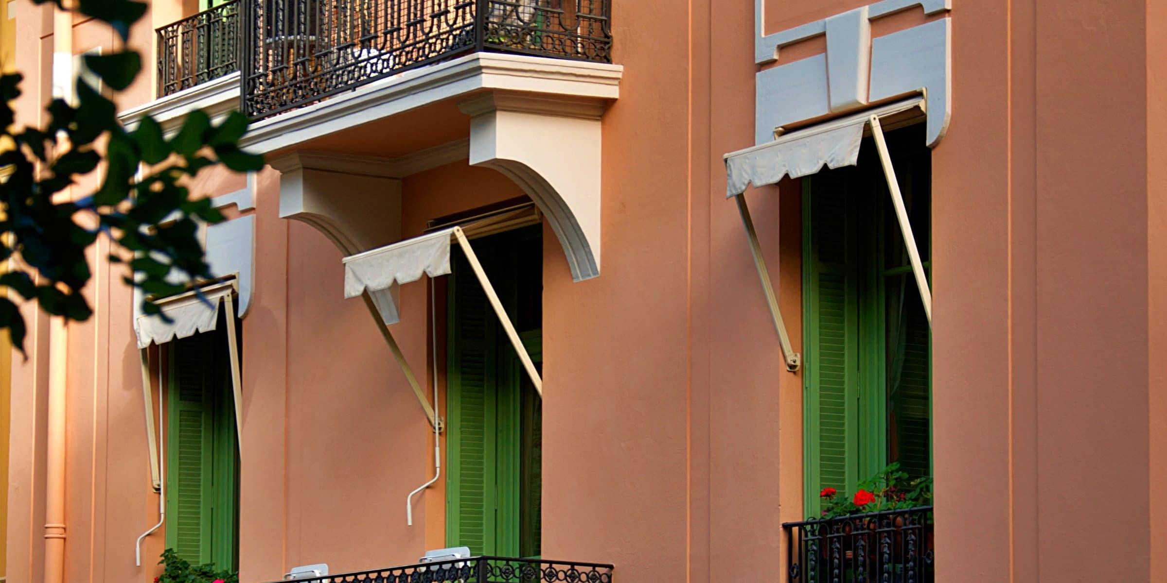 Elegant Mediterranean apartment facade with balconies