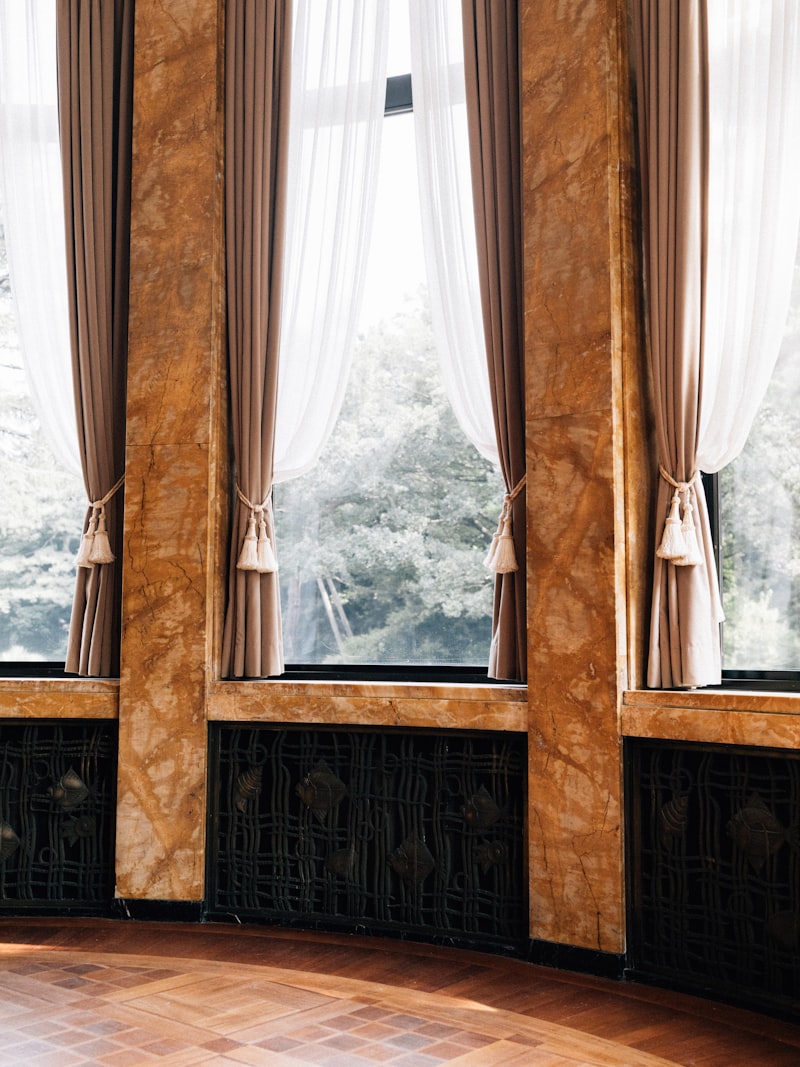 Elegant room with marble pillars and sheer curtains